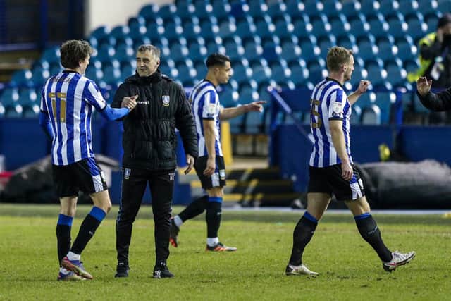 Sheffield Wednesday caretaker manager Neil Thompson celebrates with Adam Reach after a 1-0 win over Derby County.