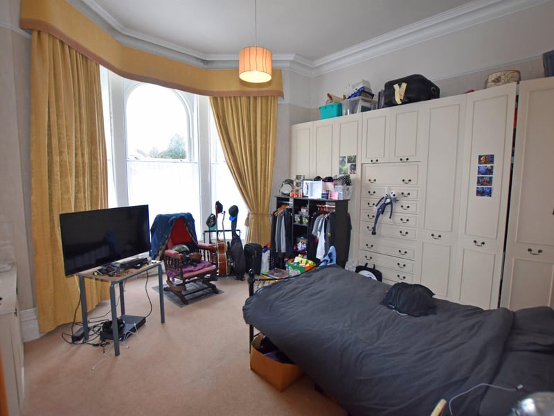 Bedroom one has a large bay window.