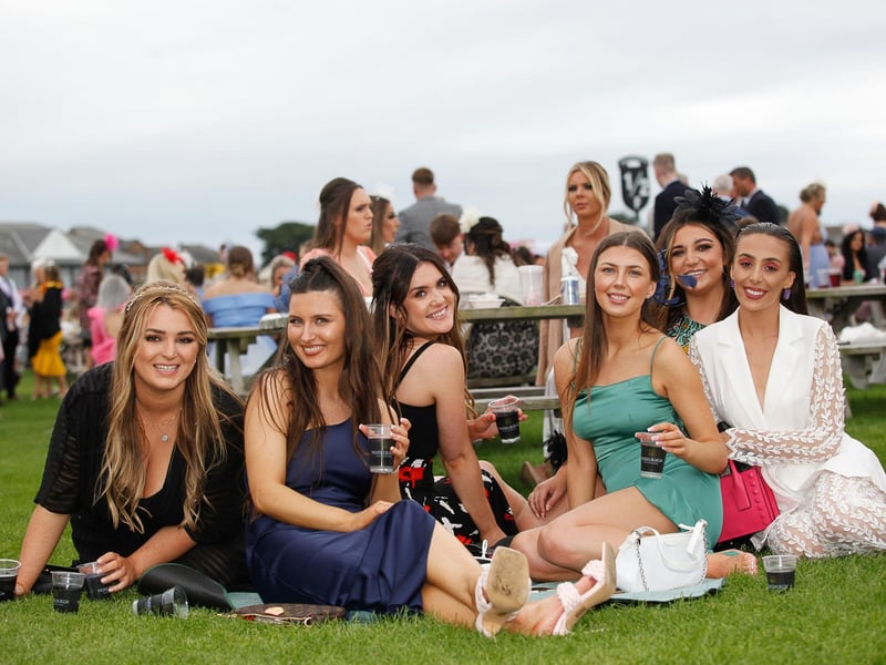 Pals from Bonnyrigg not letting their heels get in the way of getting close to the action
