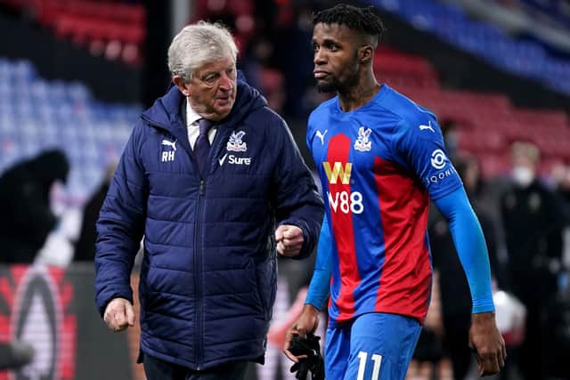 Crystal Palace manager Roy Hodgson (left) speaks to Wilfried Zaha after victory over Sheffield United - John Walton/PA Wire