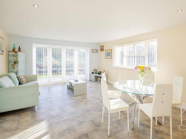 As part of the open-plan heart of the house, the kitchen extends into this lovely, bright dining area. There is room for a dining table and sofa, making it perfect for entertaining family and friends.