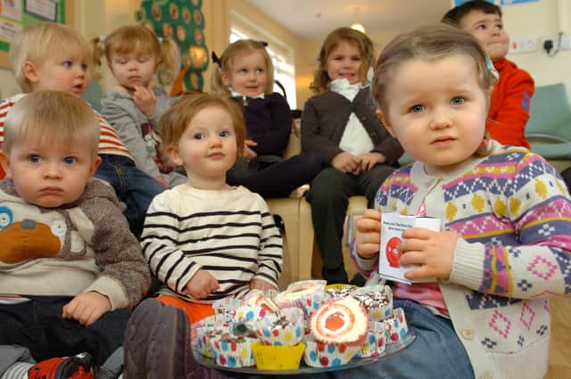 Two-year old Larna Crangle and her pals stop for a cake break during the Comic Relief fun session at the Chatham House Childrens' Centre. Remember this from seven years ago?