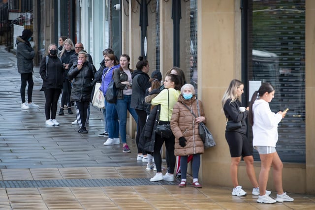 People queue outside the Primark store on Princes Street in Edinburgh, which reopens today as part of Scotland's phased plan to ease out of the coronavirus pandemic lockdown.