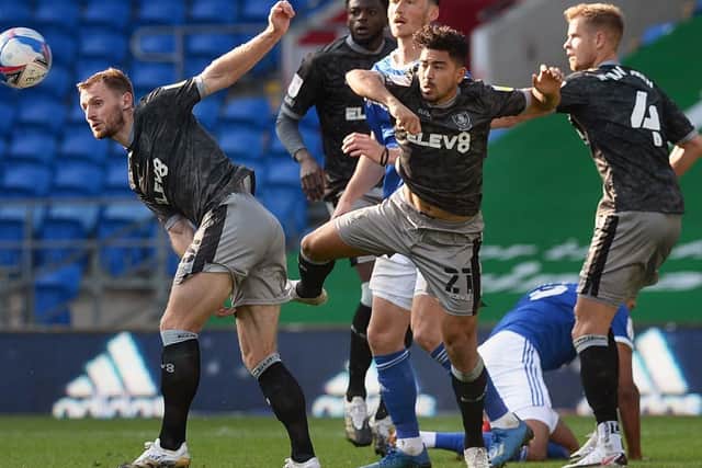 Owls trio Tom Lees, Massimo Luongo and Joost van Aken block out another Cardiff City attack. Picure: Steve Ellis.