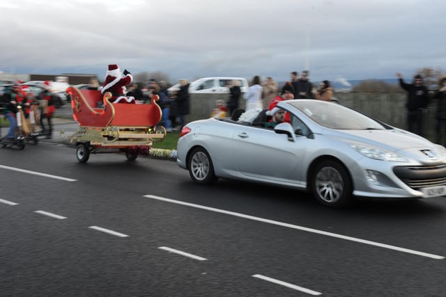 Santa waved to children and their families.