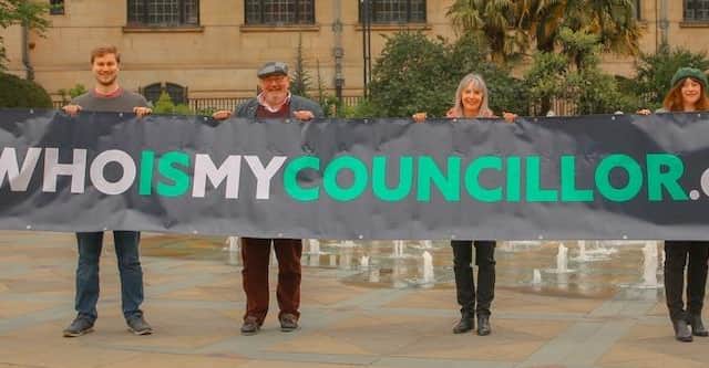 Who Is My Councillor launches their website for the 2022 local elections. Sheffield councillors hold up a banner promoting the website which aims to inform voters about candidates.