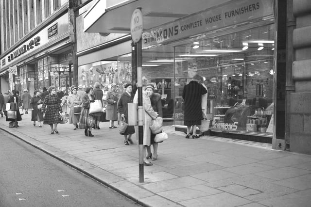 Shoppers in Fawcett Street in December 1960. Does this bring back happy memories?