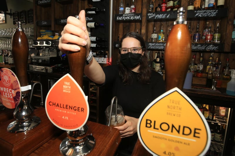 Pictured pulling a pint at the Riverside Kelham is Lauren Griggs. Picture: Chris Etchells