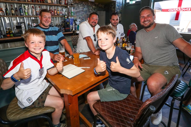 England Fans watching England V Croatia at The Shepherds Crook pub. Twins Jude and Lenny Wright, 8, from Southsea with Charlie Davies, Ryan Long, Phil Barta and Michael Whitelock. Picture: Stuart Martin (220421-7042)