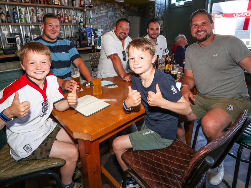 England Fans watching England V Croatia at The Shepherds Crook pub. Twins Jude and Lenny Wright, 8, from Southsea with Charlie Davies, Ryan Long, Phil Barta and Michael Whitelock. Picture: Stuart Martin (220421-7042)