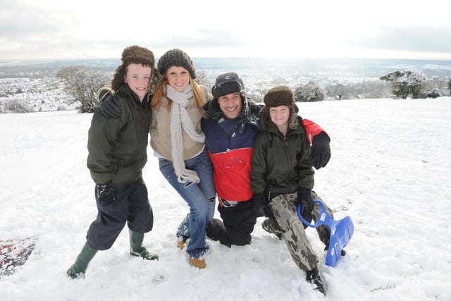 Kevin Bartholemew and Keri Clarke from Portsmouth enjoy the snow on Portsdown Hill with their children (left), Harry (10), and Oliver (seven).