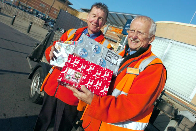 Mick Walker left and Graham 0'Connor staff at Sainsbury's, Crystal Peaks with Christmas shoe boxes collected for Operation Christmas Child in 2007.