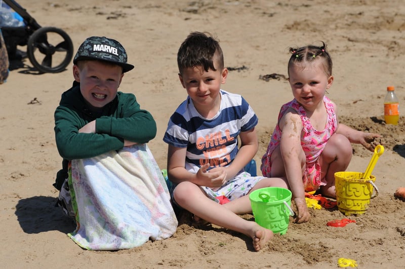 Jay Dawson, Jack Walker and Ana-Rose Walker playing in the sand.