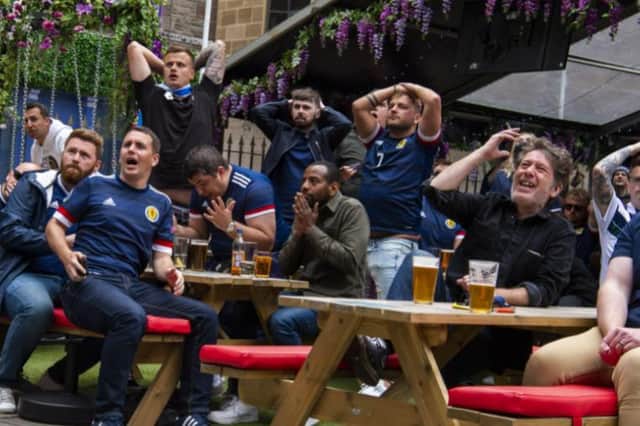 These 13 pictures show fans in Edinburgh reacting to Scotland's first Euro 2020 match.