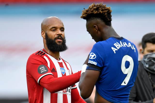Sheffield United's striker David McGoldrick (L) consoles Chelsea's Tammy Abraham (R) after the English Premier League football match between Sheffield United and Chelsea at Bramall Lane. PETER POWELL/POOL/AFP via Getty Images