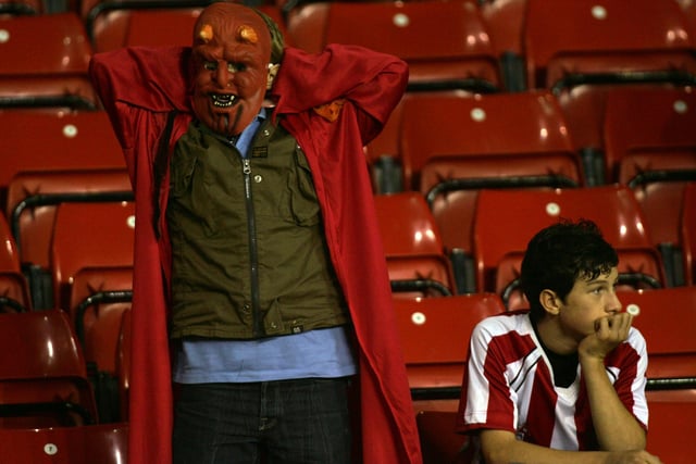 Two Dejected Blades fans after the third Arsenal goal