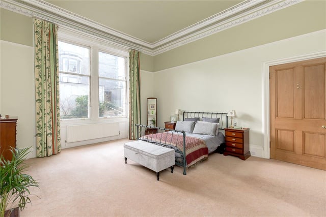 The flat boasts four double bedrooms, such as this master bedroom you can see here. There is also two kitchens, three bathrooms and a light and airy study which leads straight into the garden