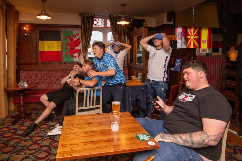 Hands on heads as fans watch the match at the Green Post, Hilsea. Picture: Habibur Rahman