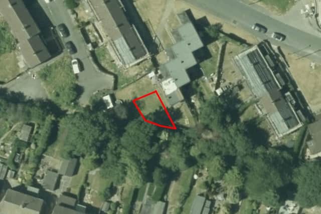 An aerial view of the site, showing the lot of land next to 26 Daresbury Drive, Arbourthorne.