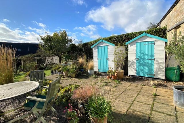 Two garden sheds essential for storing outside gardening equipment and such like.