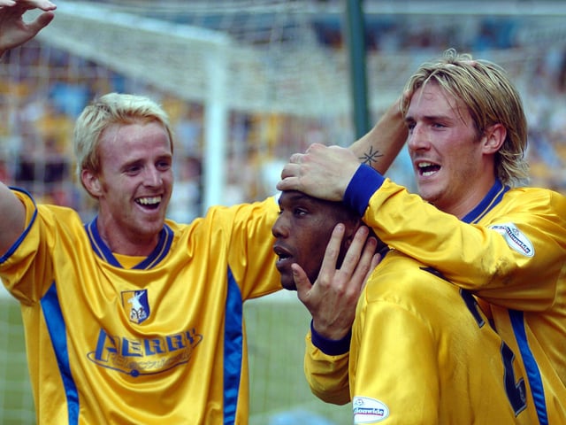 Stags players celebrate reaching the play-off final in Cardiff.