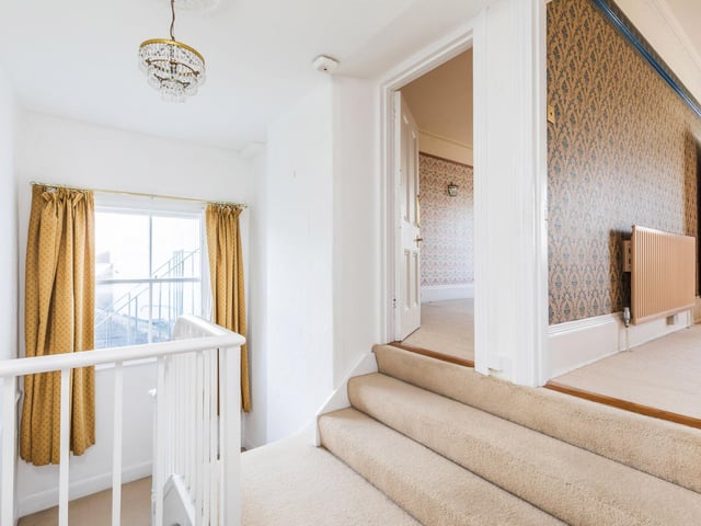 This impressive house has high ceilings, a number of architectural features including alcoves and fireplaces