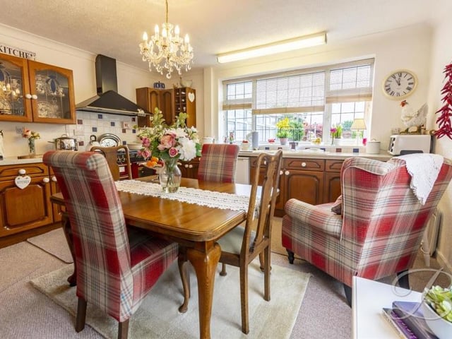 Here is another view of the kitchen's 'dining area. We're sure you'll agree it presents a fabulous spot for entertaining guests at dinner parties.