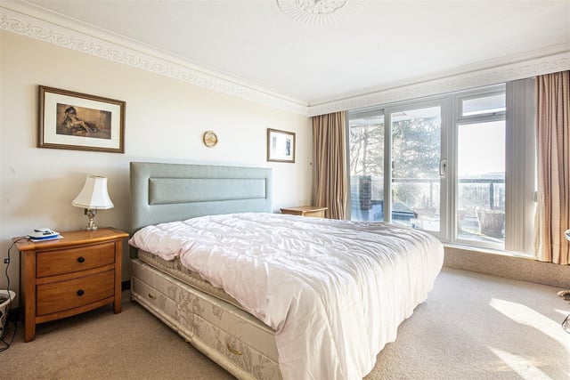 The master bedroom is accessed via the balcony and has a dressing room and en-suite.