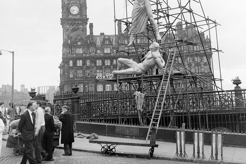 Sir Jacob Epstein's statue of St Michael and the Devil erected on the roof of Waverley Market to promote the Epstein Exhibition during Edinburgh Festival 1961.