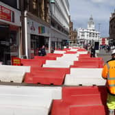 Dozens of red and white barriers have appeared on Fargate.