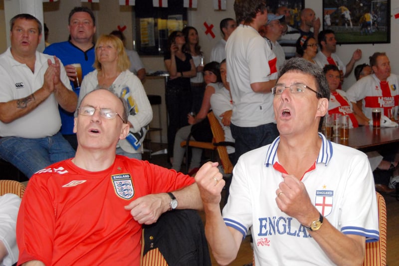 Mansfield Town staff and fans watch England's first match of the 2010 World Cup.