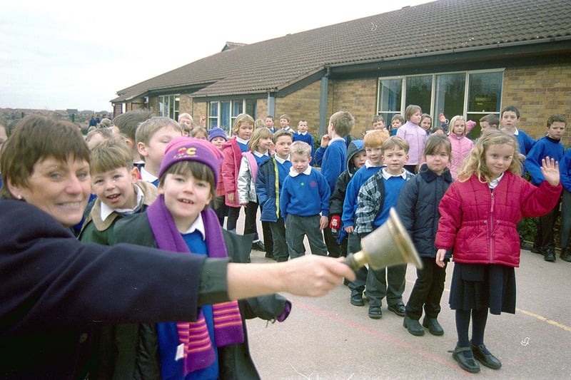 Forest Town's Holly Infants ringing their old school bell in 2001