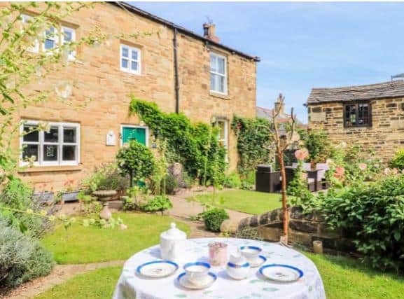 The property has beautiful grounds and two annexes.