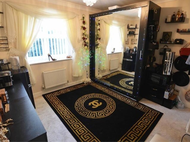 Bedroom number four at the Mansfield Woodhouse home is suitable for a variety of uses. The floor is carpeted, while the window overlooks the back garden.