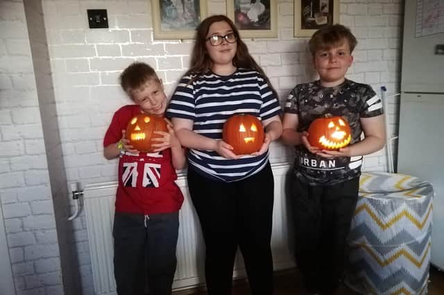 This trio have carved their own pumpkins. Image: Lyndsey Hadfield