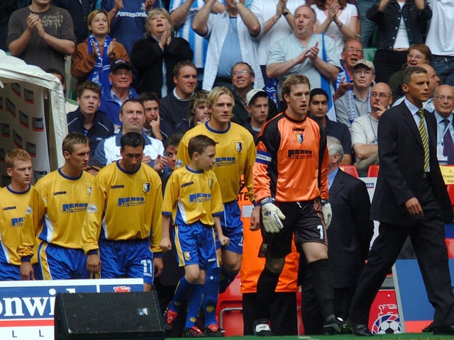 Keith Curle proudly leads his Mansfield Town side out for the play-off final at the Millennium Stadium, Cardiff.