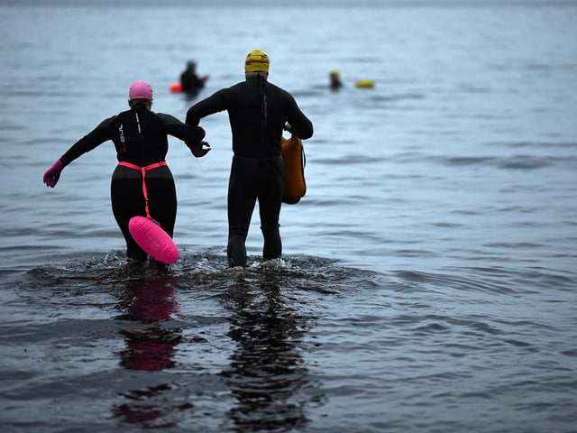 Open water swimming enthusiasts enjoy an early morning swim in Loch Lomond,Trossachs, Scotland. A new study from the UK Dementia Research Institute found that the blood of regular winter swimmers contains a "cold-shock" protein that wasn't found in that of people who did other cold-weather exercise on dry land.