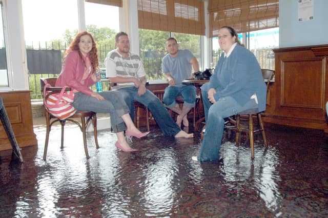 Mansfield Early Doors Manager Jemma Knight, right, waits for the flood to go down in 2007.
Also pictured from the left are: Katie Townsend, Graham Betts and Carl Beet.