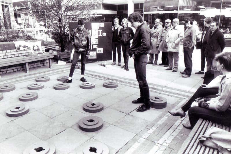 Enjoying a game of giant draughts on The Moor, Sheffield, in 1983