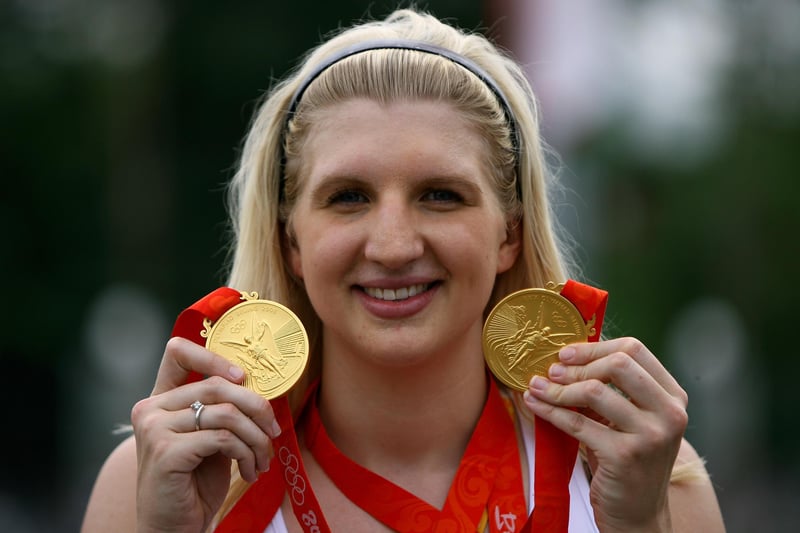 Rebecca Adlington shows off her two Olympic gold medals outside the Athletes Village.