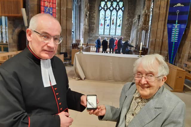 Rev Canon Keith Farrow and Rose Shaw. Mrs Shaw has presented Keith with a knife crafted by her husband, Stan, who was Sheffield's last 'little mester' before his death in 2021.