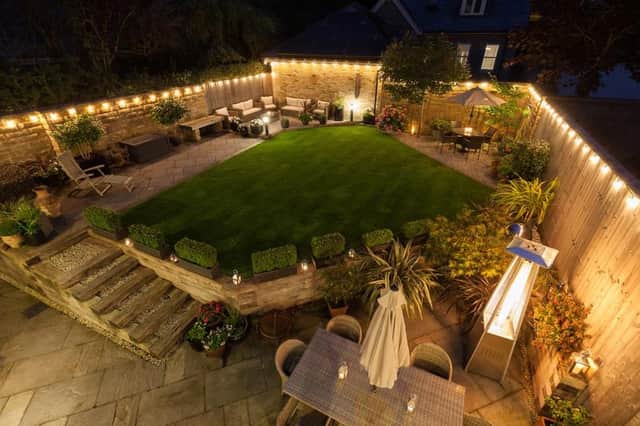 Exterior lighting is an attractive feature of the rear garden.