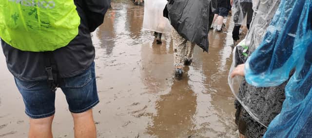 Tramlines festival-goers braving the rain and mud in Hillsborough Park, Sheffield on Sunday, July 23. Sheffield City Council said it is working with the festival organisers to ensure that the park is protected from damage in future. Picture: Julia Armstrong, LDRS