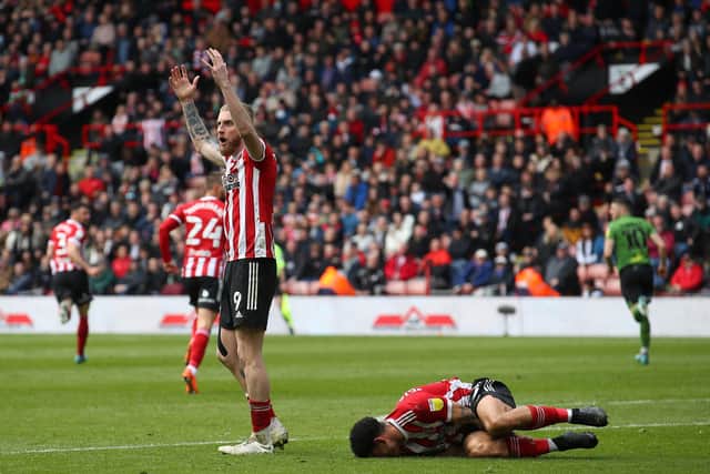Oli McBurnie of Sheffield United appeals for a penalty after Morgan Gibbs-White was wiped out against Bournemouth: Simon Bellis / Sportimage