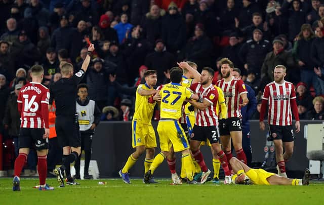 Sheffield United's Charlie Goode (26) is shown a red card by referee Matthew Donohue during the Sky Bet Championship match at Bramall Lane. Picture: Mike Egerton/PA Wire.