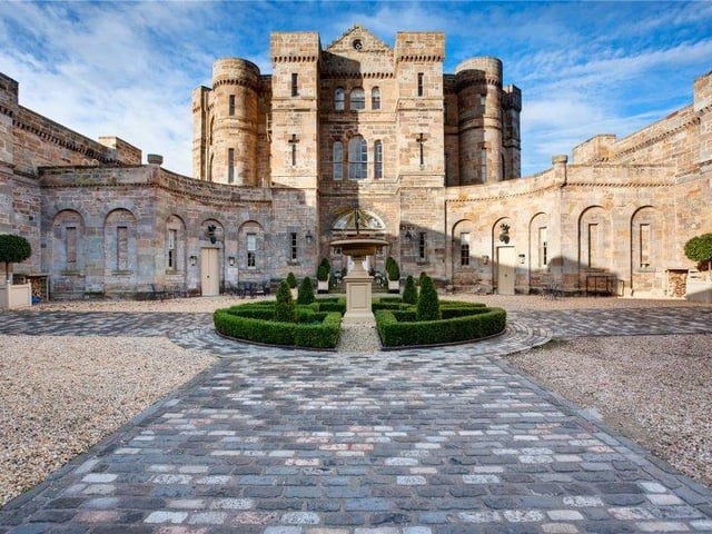 The parterre courtyard is the perfect place to admire the external castellated features of the property, including the slit windows, turrets and period sandstone and limestone.