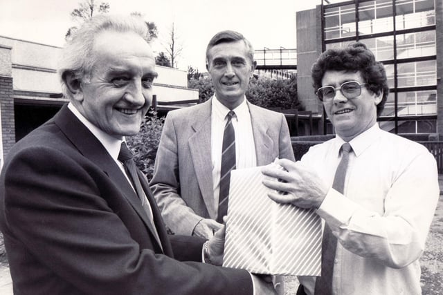 Arthur Colledge, left, receives a gift as he retires from Jordanthorpe Comprehensive School, pictured here with Ron Webb and Frank Goodall, July 1988