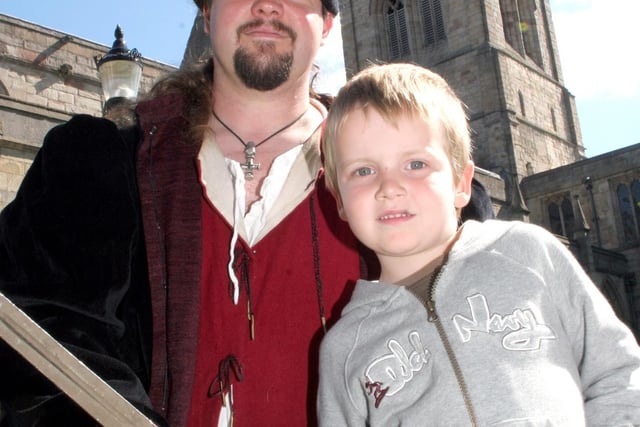 Tom Burton, 4, from Tupton with Simon Lee, of the Thomas Stanley Retinue,  on Chesterfield Medieval Market day.