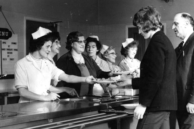 Cathleen Devlin, centre, helps dish up the day's menu to Grammar-Technical for Boys pupils in 1973. Headmaster Mr W E Egner joins the queue to sample the meals. Remember this?