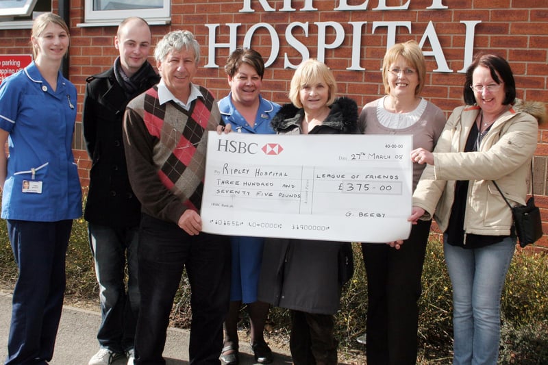 Ripley Hospital receives a cheque in 2008 to continue the good work. Staff nurse Jemma Musson, Chris Thompson, Dr Joe Veale, Staff Nurse Karen Knowles, Gladys Beeby, Senior Sister Ann Lebelinski and Pearl Faulkner are pictured.